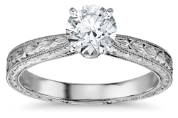 White gold and engraved millgrain diamond solitaire engagement ring