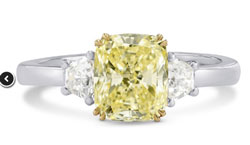 yellow diamond engagement ring with white diamond side stones