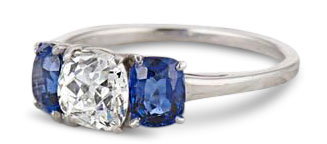 old mine cut diamond engagement ring with sapphire side stones