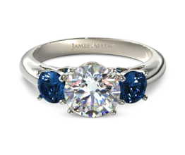 Three stone diamond ring with sapphire side stones