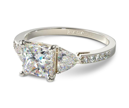 Three stone princess cut engagement ring with trillion side stones