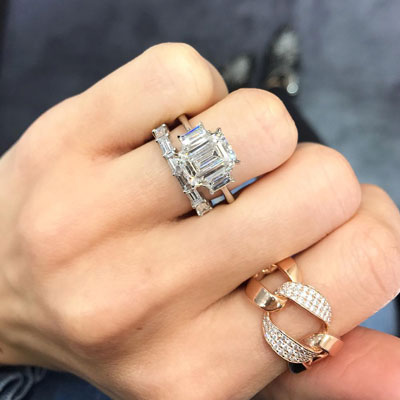 4 carat three stone emerald cut ring with straight baguette side stones