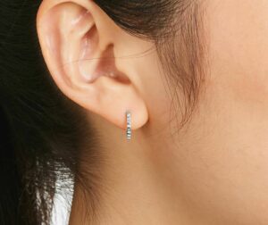 K White Gold Baguette Huggie Hoop Earrings on ear