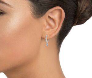 Heart Shaped Lab Diamond Huggie Earrings on ear