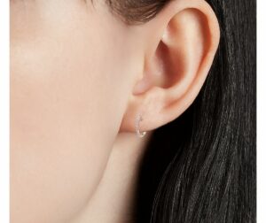 Petite Diamond Huggie Hoop Earrings in k Rose Gold on ear